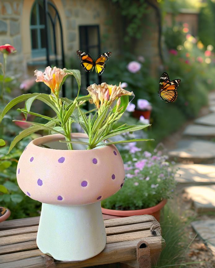 Pink polka dot mushroom-shaped planter with flowers and butterflies in a garden setting