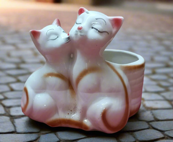 Add some charm to your home with Cutie Cats ceramic pots! These adorable pots not only hold your plants, but also add a touch of whimsy and personality to any room. Perfect for cat lovers and anyone looking to add a little cuteness to their space. Measuring at just the right size, they are perfect for small succulents and herbs. Bring home a little feline fun with Cutie Cats!