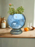 Transform your space with our Globe Planter! This unique and aesthetically pleasing piece adds a touch of elegance and charm to any room. Its versatile design allows for a variety of plant options, making it perfect for succulents, flowers, or herbs. Enhance your surroundings and bring nature indoors with our Globe Planter.
