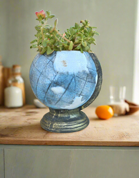 Transform your space with our Globe Planter! This unique and aesthetically pleasing piece adds a touch of elegance and charm to any room. Its versatile design allows for a variety of plant options, making it perfect for succulents, flowers, or herbs. Enhance your surroundings and bring nature indoors with our Globe Planter.
