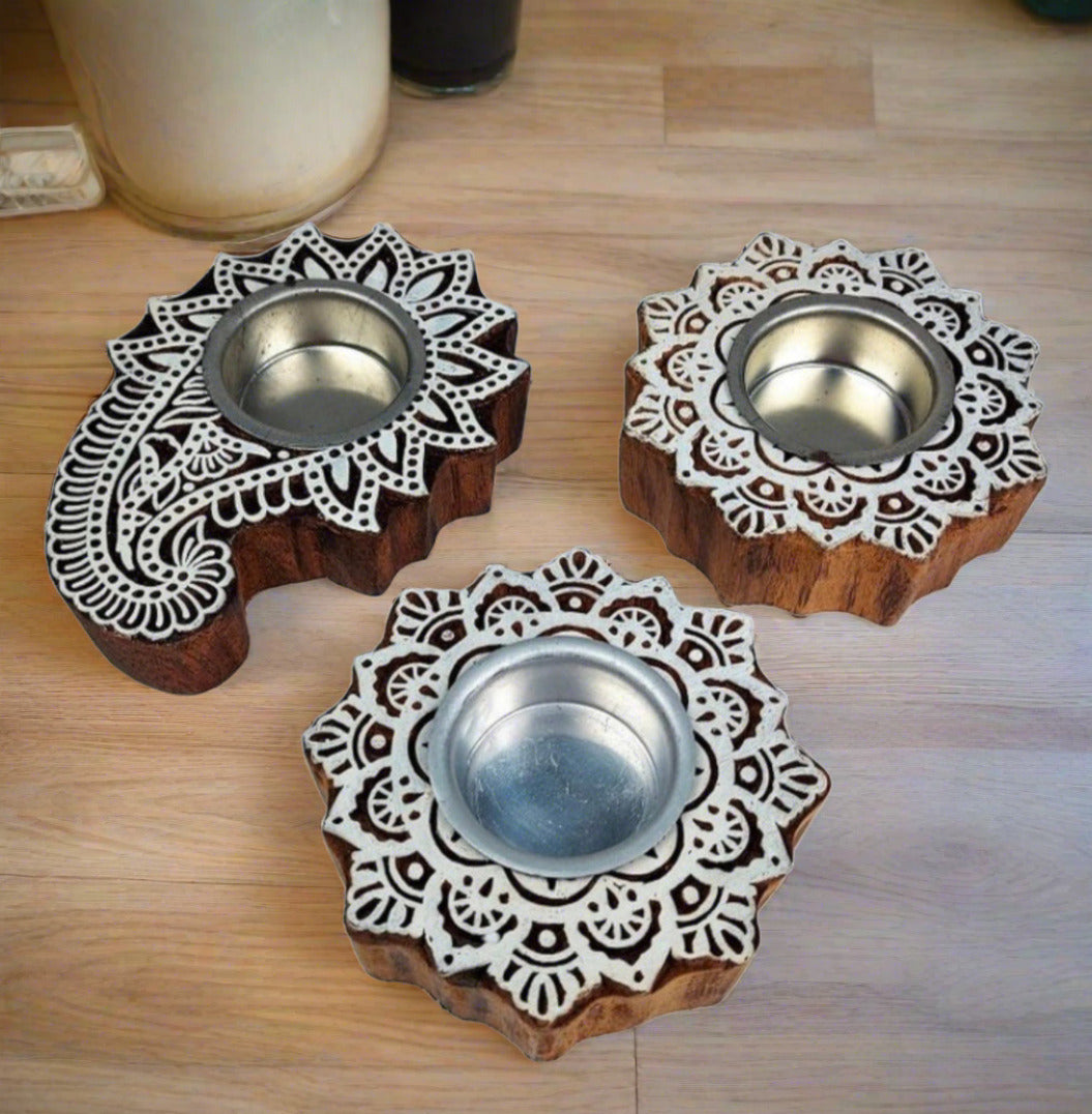 These Hand-carved Wooden Tea Light Candle Holders are made of Pure Sheesham Wood.Handcrafted using traditional carving skills and techniques.The Tea Light candles can be replaced as many times.&nbsp;  &nbsp;&nbsp;&nbsp;&nbsp;&nbsp;&nbsp;&nbsp;&nbsp; Material: Pure Sheesham Wood    &nbsp;&nbsp;&nbsp;&nbsp;&nbsp;&nbsp;&nbsp;&nbsp; Dimensions: 4 inches      *Pack Contains 2&nbsp; Candle Holders with Complimentary 2 White Tea Light Candles.