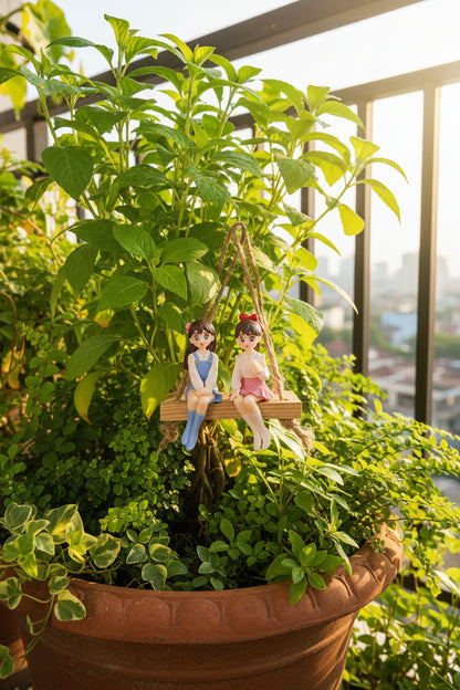 Two dolls on a swing against a plain background