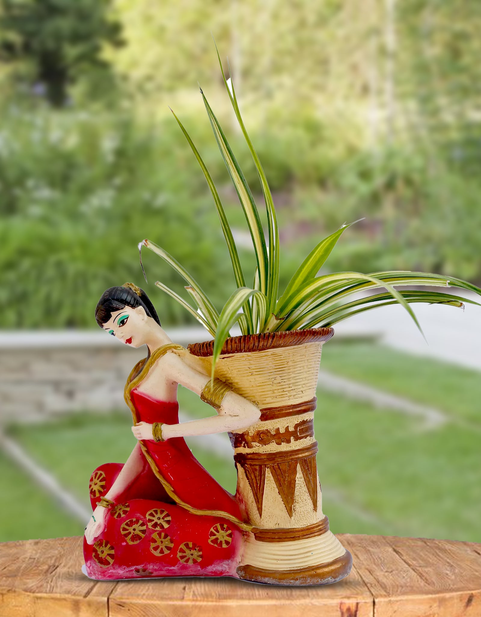 The Planter Girl, the perfect addition to your indoor or outdoor garden. This girl planter adds a touch of whimsy and charm, enhancing any plant it holds. Handcrafted with care, it is a unique and delightful way to showcase your greenery. Experience the joy of gardening with EVA-The Planter Girl.