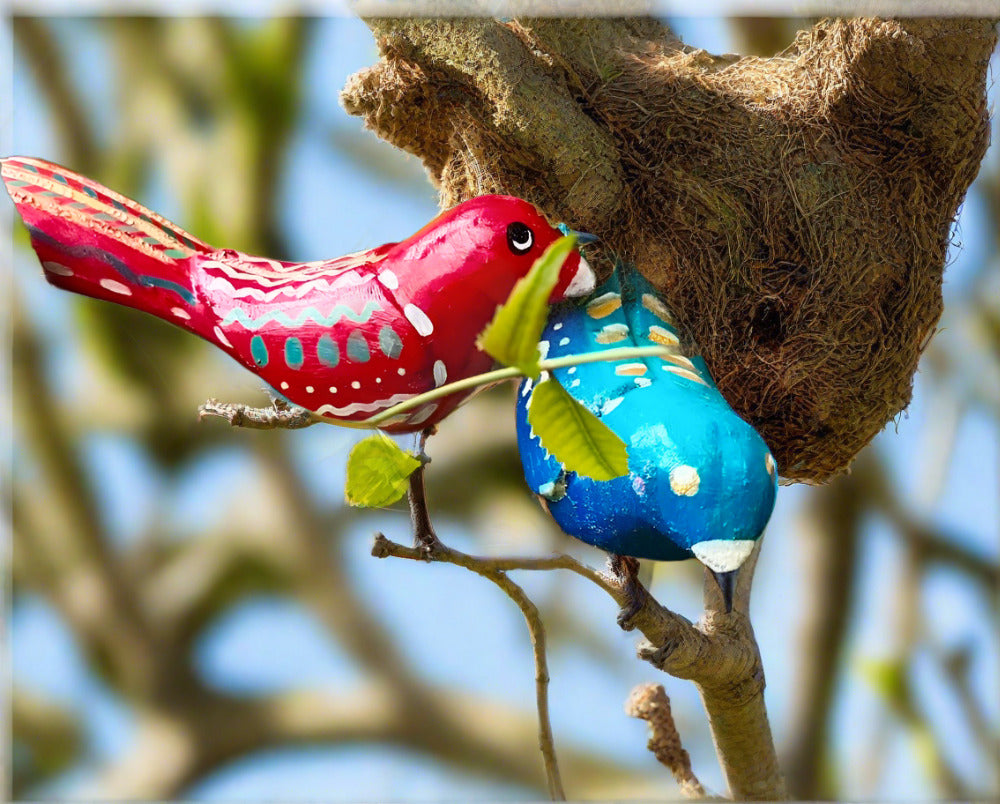 Wooden Chirping birds with iron legs are excellent gifting options for garden lovers. Place them randomly on your plants to replicate more closely to nature. 